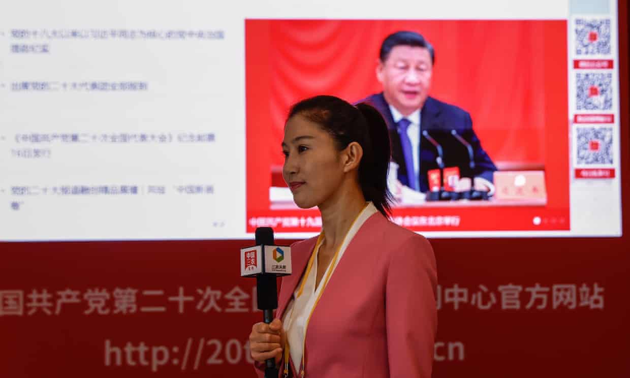 A journalist reports in front of a screen displaying the Chinese leader, Xi Jinping, in Beijing before the 20th congress of the Communist party. Photograph: Mark R Cristino/EPA