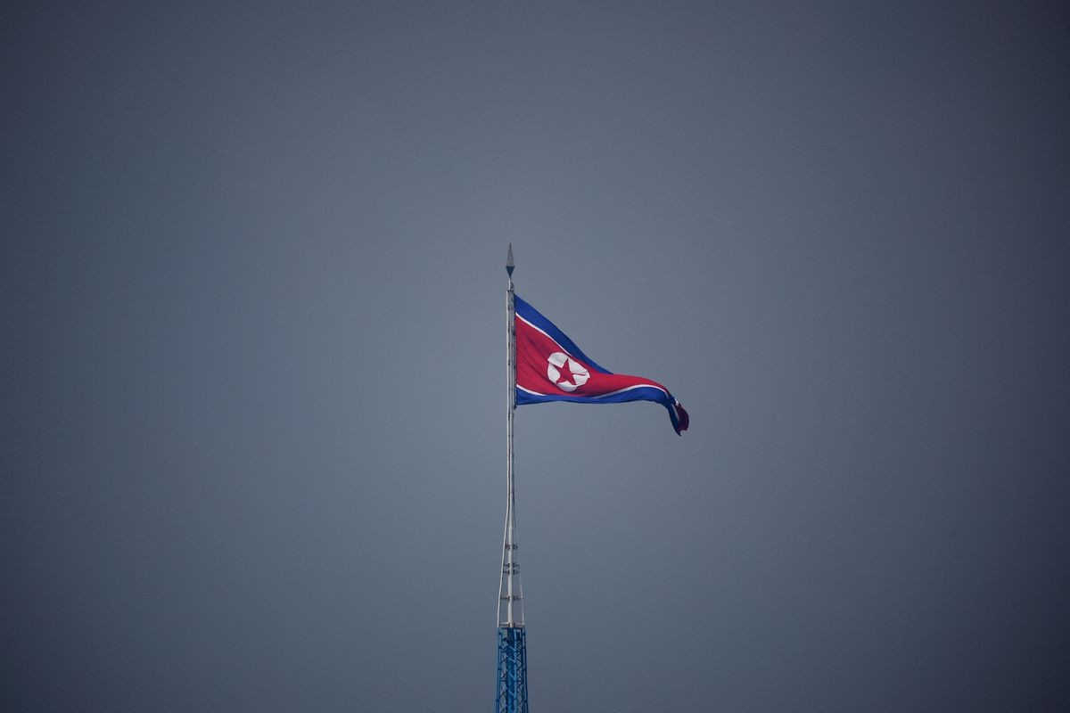 A North Korean flag flutters at the propaganda village of Gijungdong in North Korea, in this picture taken near the truce village of Panmunjom inside the demilitarized zone (DMZ) separating the two Koreas, South Korea, July 19, 2022. REUTERS/Kim Hong-Ji/Pool/File Photo