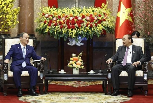 President Nguyen Xuan Phuc receives former Japanese Prime Minister Suga Yoshihide