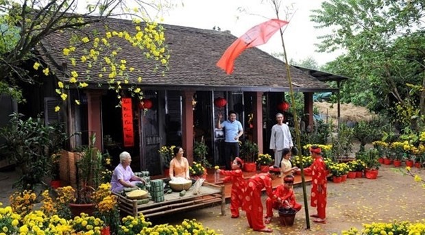 Tradition of raising the Neu (or Tet) pole remains alive today in many villages and homes around the country (Photo: baochinhphu.vn)