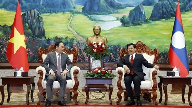 General Secretary, President of Laos received Vietnamese Party delegation