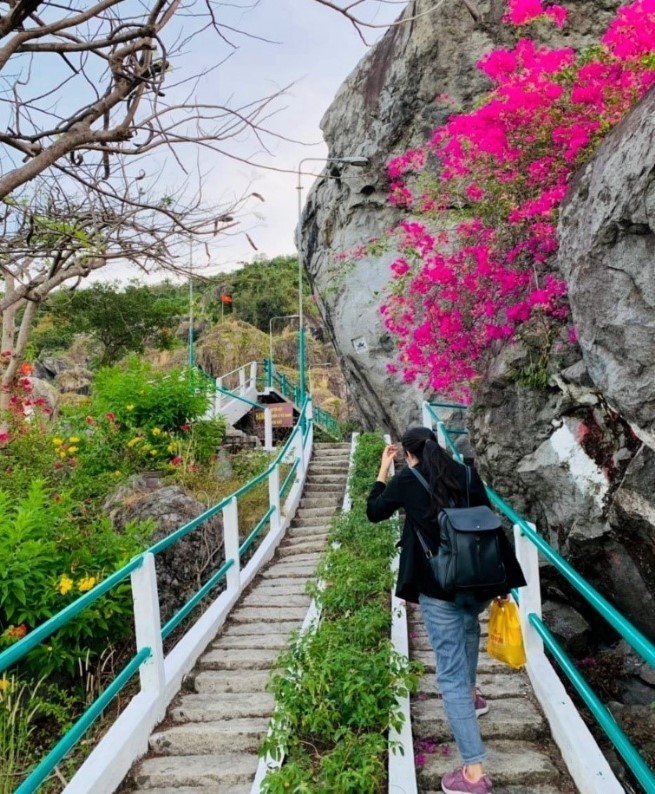 The path is decorated with flowers