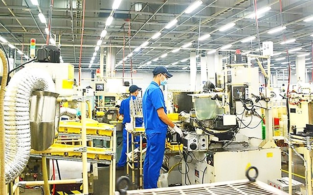 Workers at a factory in HCM City. The city seeks to revive industrial growth. — VNA/VNS Photo