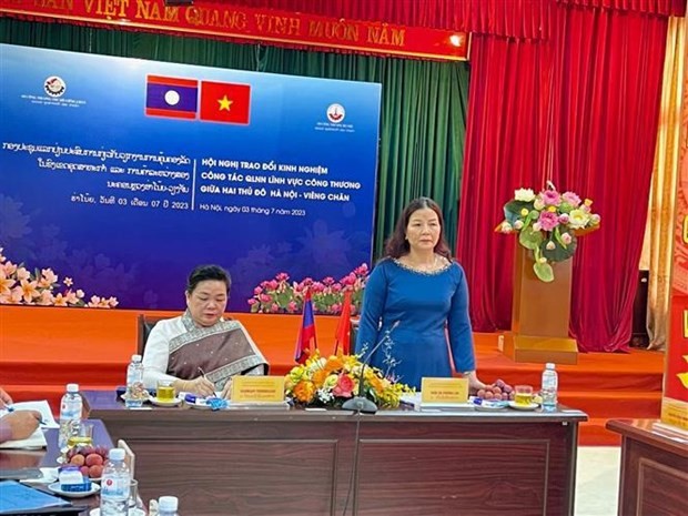 Hanoi, Vientiane share experience in State management in industry, trade