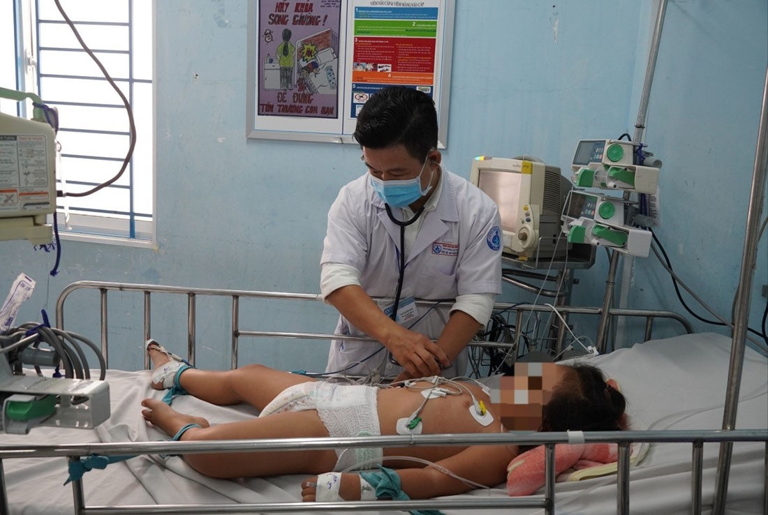 A doctor examines a child with hand-foot-mouth disease at the HCM City Children’s Hospital No 1.