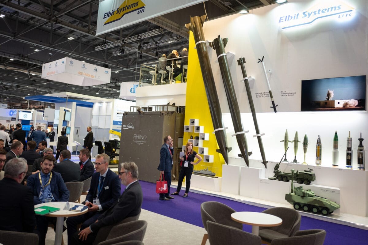 A man looks at a display of rockets from Elbit Systems UK including the Predator Hawk (L) and the Extra (2L) as delegates enjoy drinks at the end of day one of the DSEI arms fair at ExCel on September 10, 2019 [Leon Neal/Getty Images]