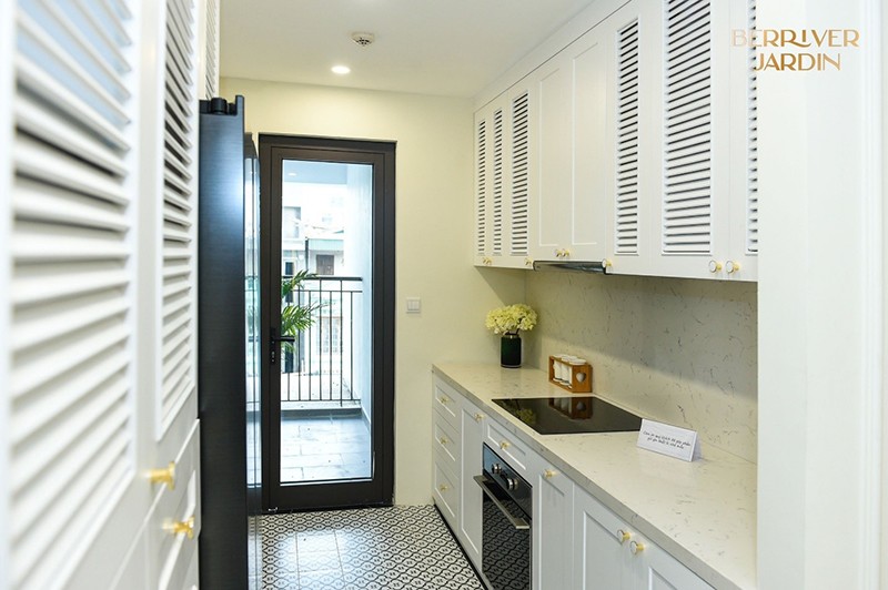 The kitchen area has a modern interior layout and is designed separately.