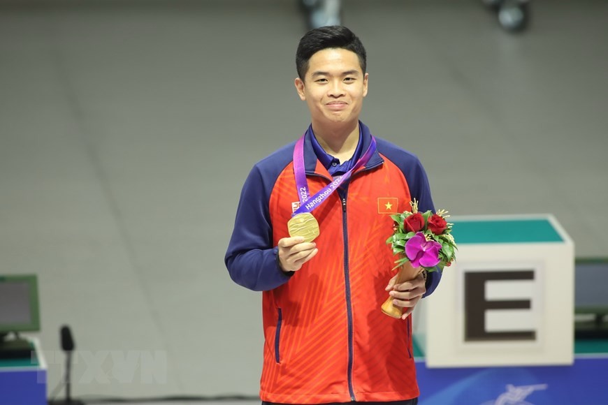 ASIAD 19: Hình ảnh VĐV Phạm Quang Huy thi đấu và nhận Huy chương vàng, Huy chương đồng môn bắn súng