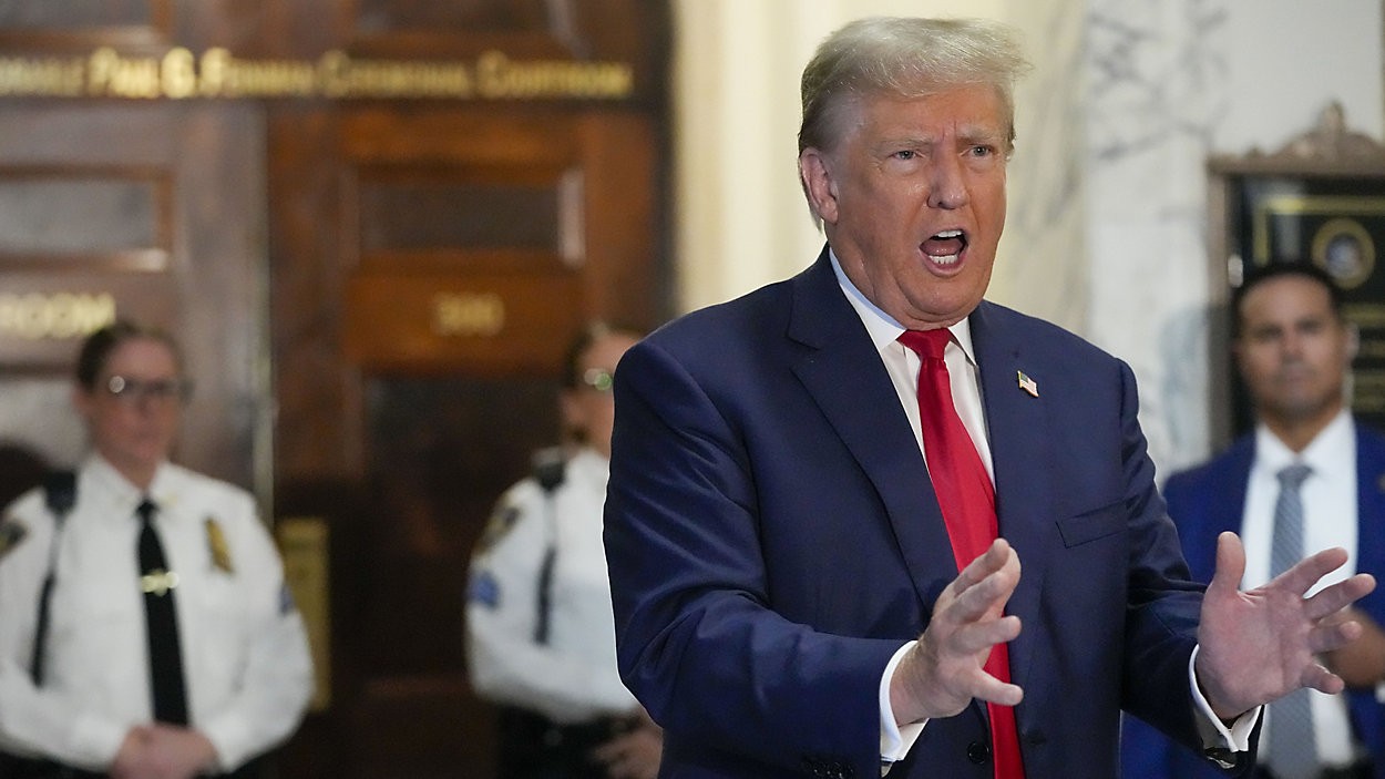 Former President Donald Trump speaks to the media before entering the courtroom at New York Supreme Court, Wednesday, Oct. 4, 2023, in New York. (AP Photo/Mary Altaffer)