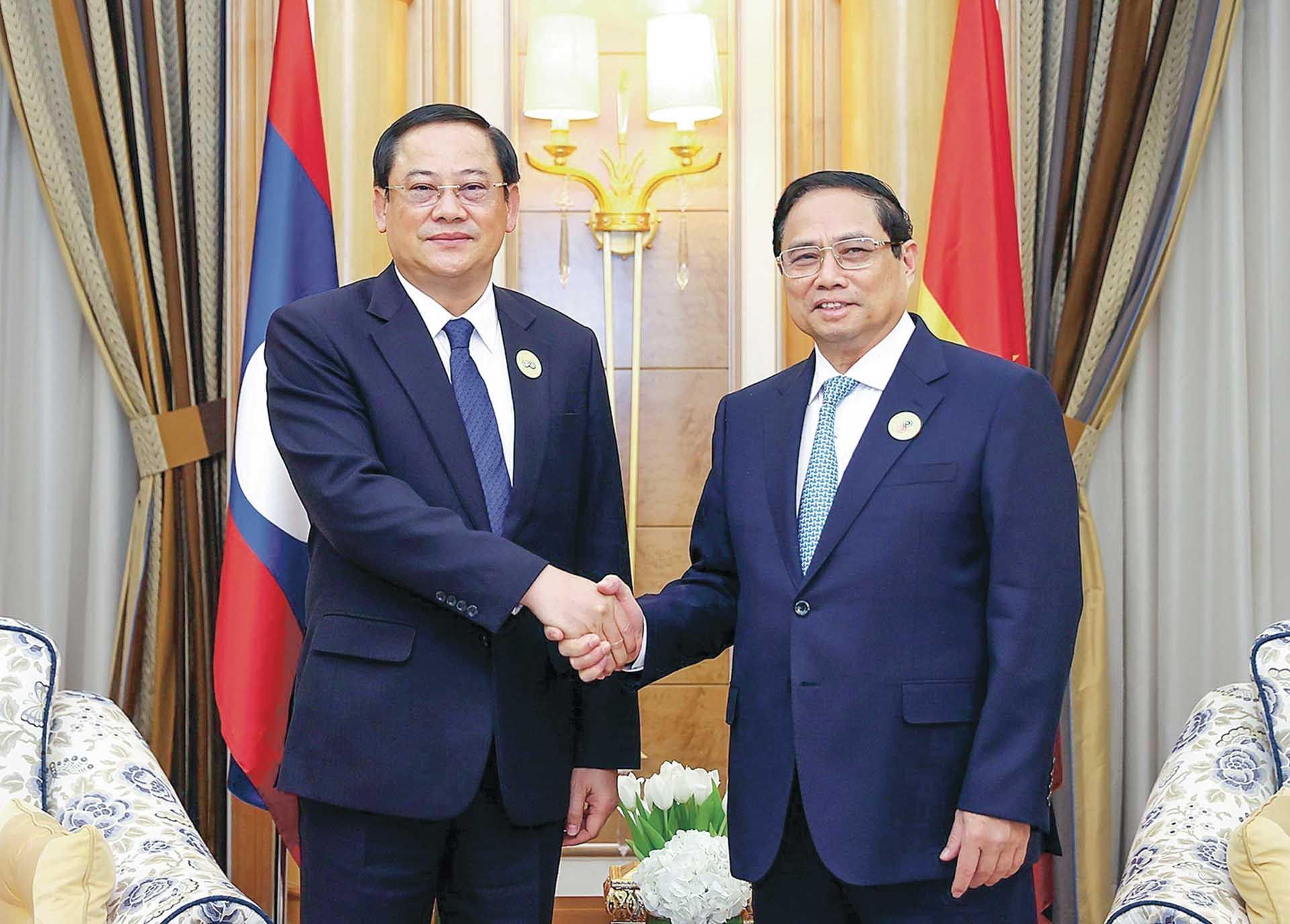 Thủ tướng Phạm Minh Chính gặp Thủ tướng Lào Sonexay Siphandone nhân dự Hội nghị cấp cao ASEAN - Hội đồng Hợp tác Vùng Vịnh (GCC) tại Saudi Arabia, ngày 20/10/2023. (Nguồn: TTXVN)
