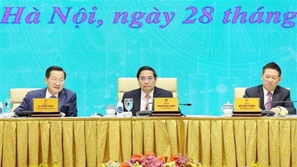 PM Pham Minh Chinh chairs conference urging efforts to upgrade stock market to emerging status
