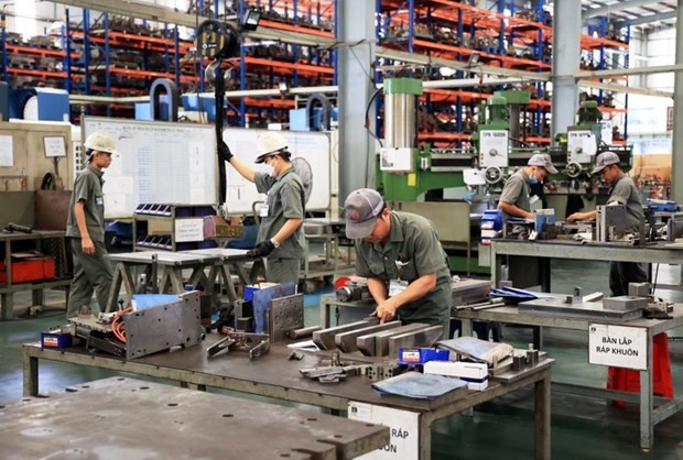 Workers at Toan Cau Mechanical Company - a FDI firm in Giang Dien Industrial Park, Trang Bom district, Dong Nai province. (Photo: VNA)