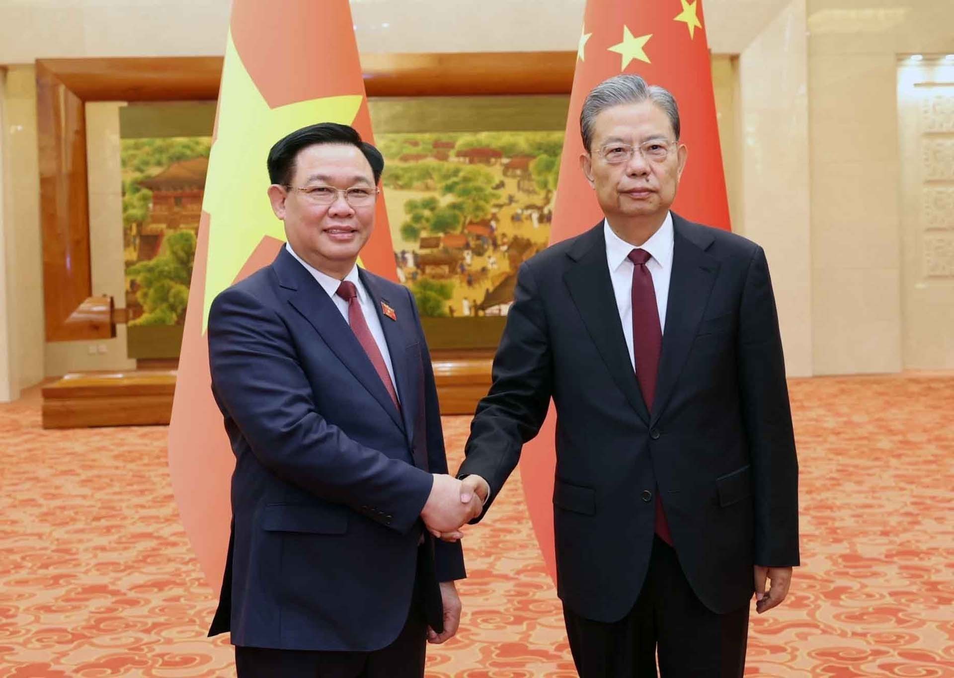 Chủ tịch Quốc hội Vương Đình Huệ hội đàm và ký thỏa thuận hợp tác với Ủy viên trưởng Nhân đại toàn quốc Trung Quốc Triệu Lạc Tế