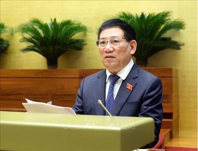 Minister of  Finance Ho Duc Phoc delivered report on financial-budget tasks