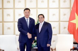 Thủ tướng Phạm Minh Chính tiếp lãnh đạo Công ty TNHH Đầu máy và toa xe lửa Đại Liên, Trung Quốc (CRRC)