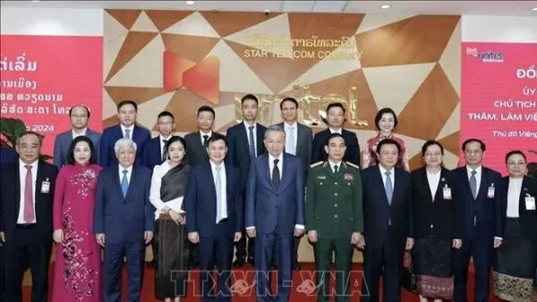 President To Lam visits telecom joint venture Star Telecom in Laos