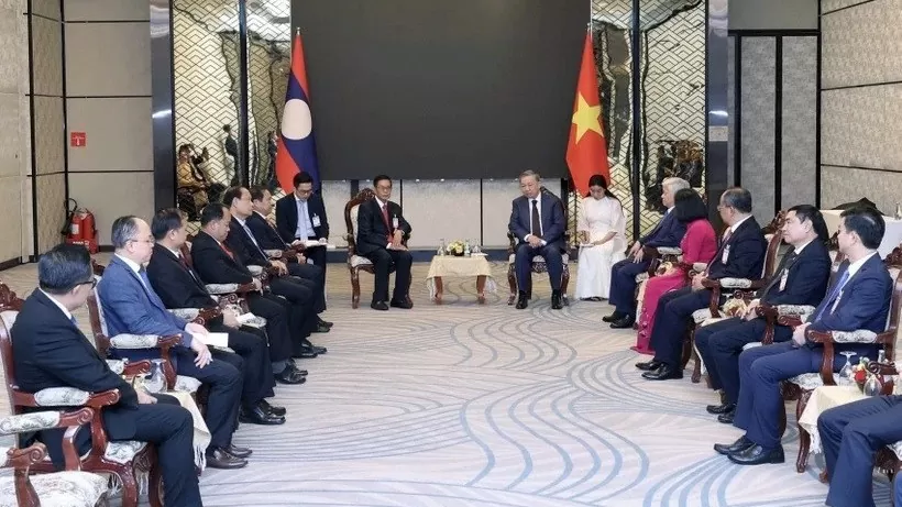President To Lam receives Laos front leader Sinlavong Khoutphaythoune in Vientiane