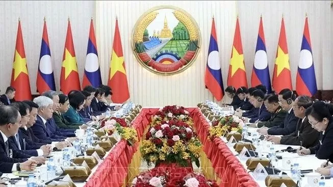 President To Lam meets Lao Prime Minister Sonexay Siphandone in Vientiane