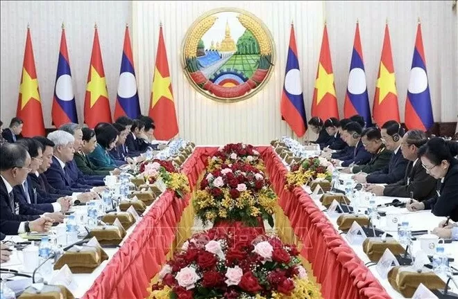 President To Lam meets Lao Prime Minister Sonexay Siphandone in Vientiane