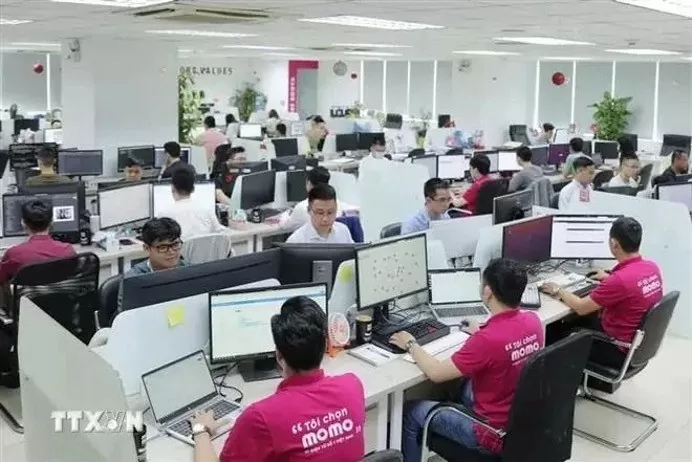 The Momo e-wallet staff at their office. (Photo: VNA)