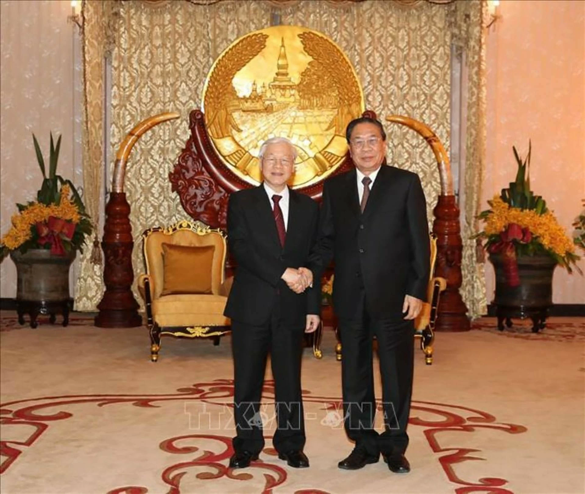 Tổng Bí thư-Chủ tịch nước Nguyễn Phú Trọng gặp đồng chí Choummaly Sayasone, nguyên Tổng Bí thư-Chủ tịch nước Lào, tại thủ đô Vientiane, trong chuyến thăm hữu nghị chính thức nước Cộng hòa Dân chủ Nhân dân Lào ngày 24/2/2019. (Nguồn: TTXVN)