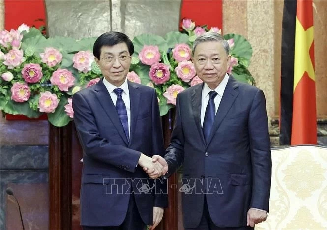 President To Lam (R) and Chairman of the National Committee of the Chinese People's Political Consultative Conference Wang Huning