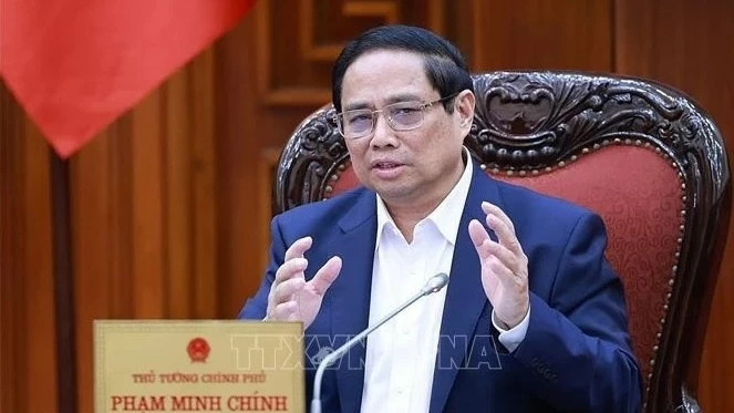 PM Pham Minh Chinh chairs meeting to review legal documents facilitating development