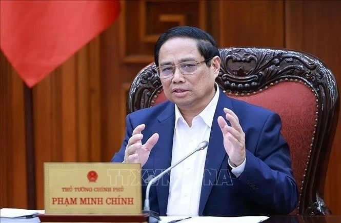 PM Pham Minh Chinh chairs meeting to review legal documents facilitating development