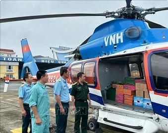 More helicopters take flight to transport relief packages for flood victims