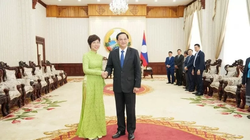 Lao Prime Minister Sonexay Siphandone receives VNA General Director in Vientiane