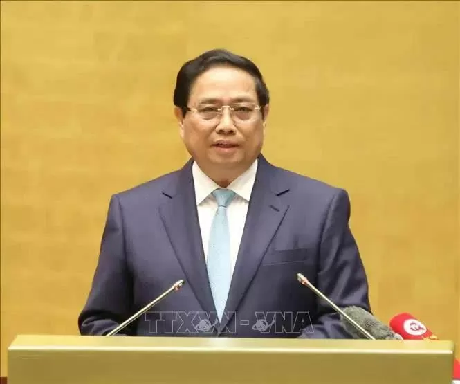 Prime Minister Pham Minh Chinh delivers a report at the national conference on December 1 to review the implementation of Resolution No. 18-NQ/TW issued by the 12th Party Central Committee.(Photo: VNA)