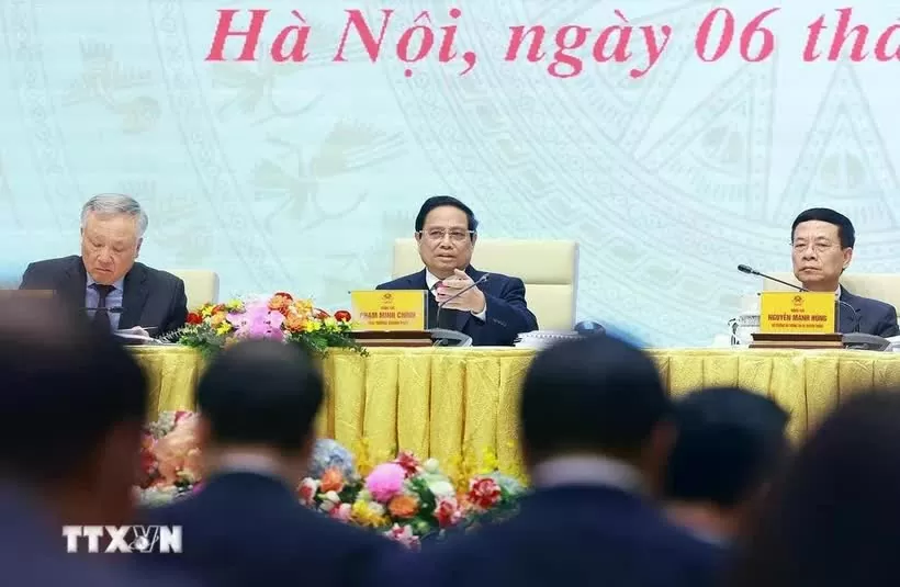 Prime Minister Pham Minh Chinh chairs a meeting to review the activities of the National Committee for Digital Transformation and Project 06. (Photo: VNA)