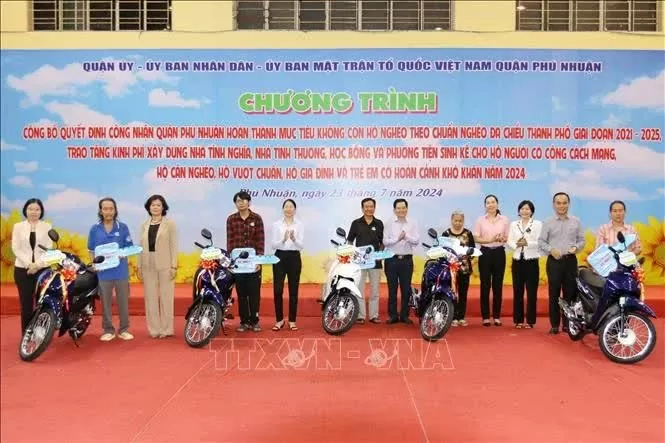 Near-poor and disadvantaged households in HCM City’s Phu Nhuan district receive motorbikes as a means of livelihood. (Photo: VNA)