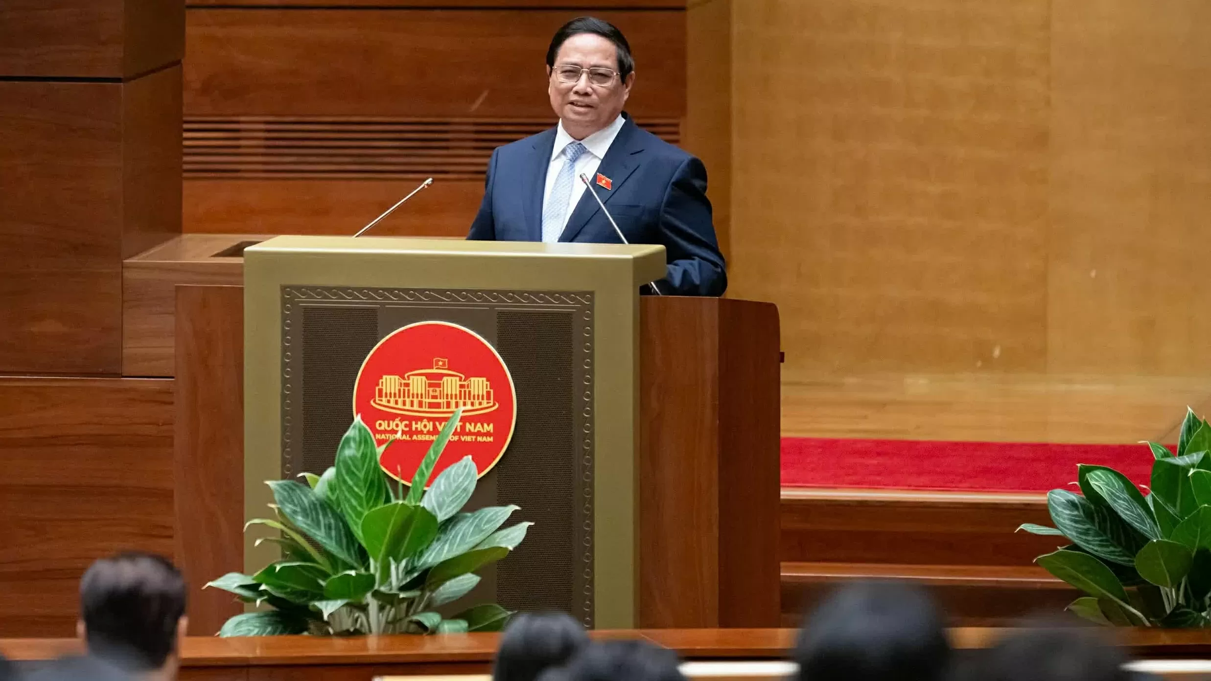 Prime Minister Pham Minh Chinh presents report on socio-economic development at NA's 9th session