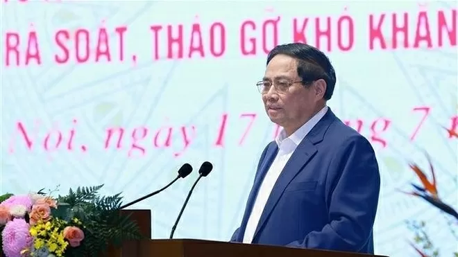 Prime Minister Pham Minh Chinh attends national conference, calls for swift and humane resolution of stalled projects