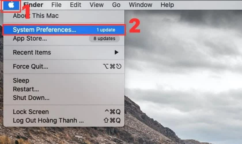 Nhấn vào menu Apple rồi chọn System Preferences.