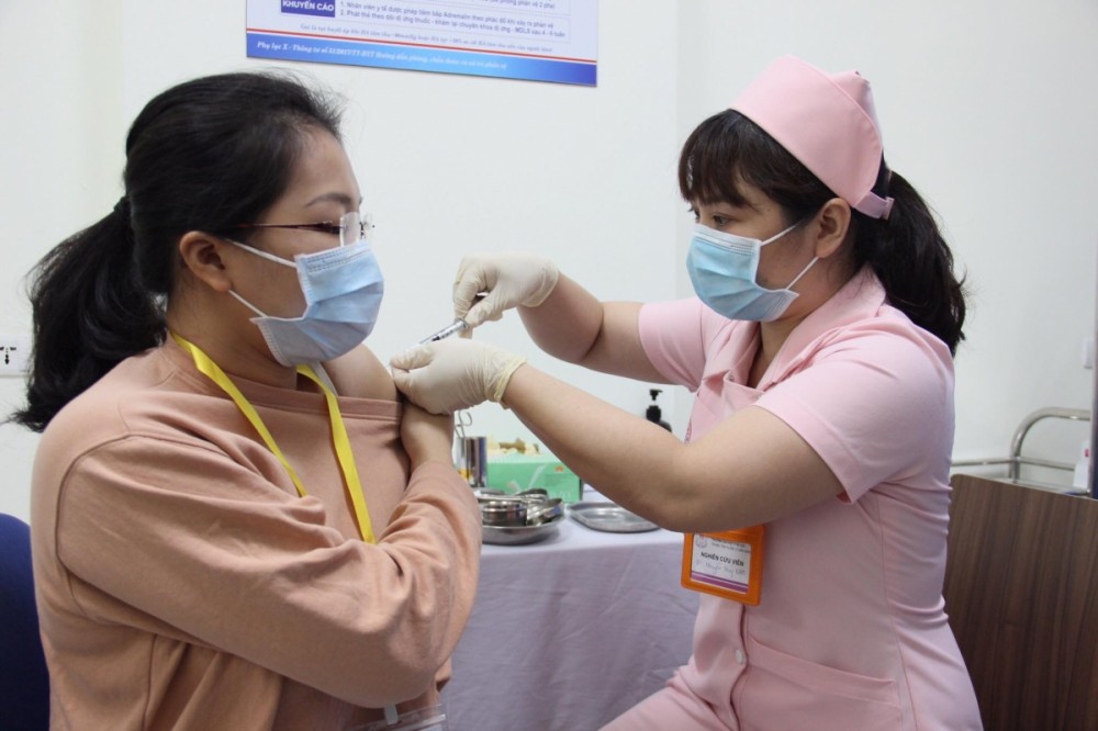 A volunteer is given the Covivac vaccine shot.