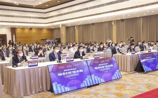 Đại biểu dự Diễn đàn Kinh tế Việt Nam 2021. (Nguồn: TTXVN)