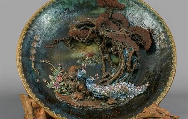 The world’s largest carved ceramic plate measures 137cm and weighs 400kg. (Photo courtesy of Guinness World Records)