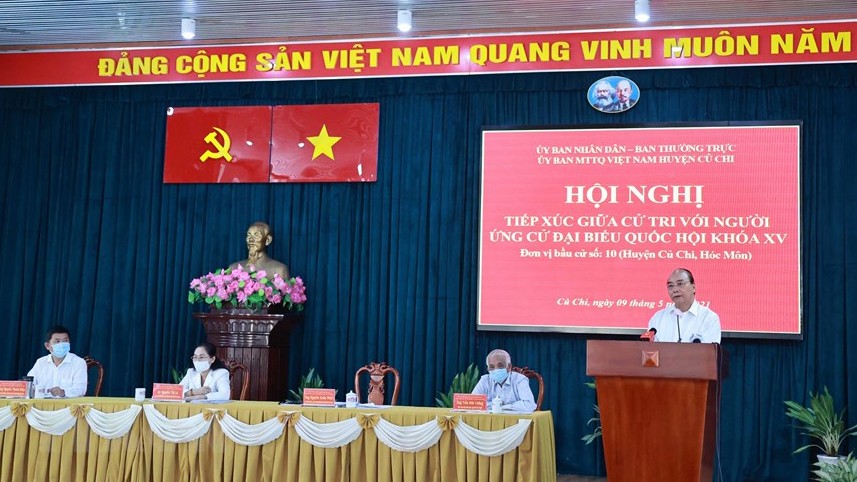 Chủ tịch nước Nguyễn Xuân Phúc trình bày chương trình hành động tại buổi tiếp xúc cử tri huyện Củ Chi ngày 9/5. (Ảnh: Thống Nhất/TTXVN)