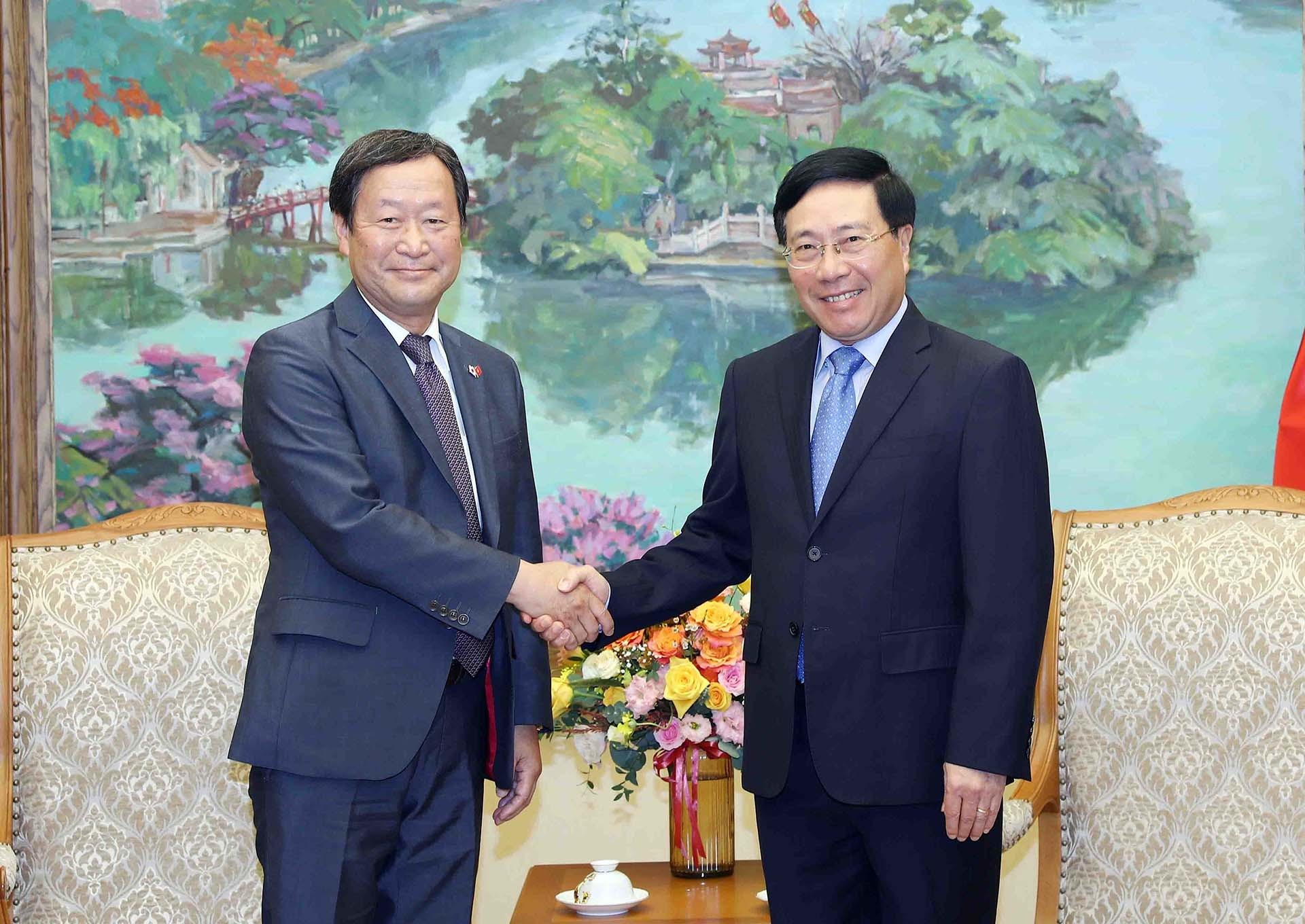 Phó Thủ tướng Thường trực Phạm Bình Minh tiếp Phó Chủ tịch điều hành cấp cao JICA Junichi Yamada. (Nguồn: TTXVN)