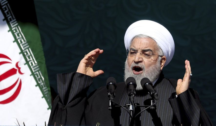 Iranian President Hassan Rouhani speaks during a ceremony celebrating the 41st anniversary of the Islamic Revolution, at the Azadi, Freedom, Square in Tehran, Iran, Tuesday, Feb. 11, 2020. AP