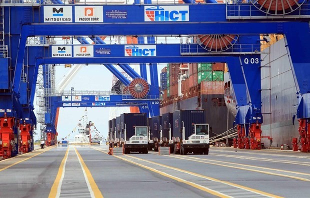 Containers of goods are loaded at Hai Phong Port in northern Viet Nam. (Photo: VNA)