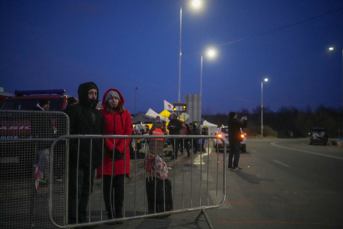 Ukrainian refugees cross the border in Vysne Nemecke, Slovakia, on March 4. CHRISTOPHER FURLONG/GETTY IMAGES