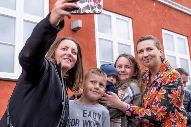 Denmark’s Prime Minister Mette Frederiksen, right, has urged Danes to support the overturning of the country’s opt-out from the EU defense policy following Russia’s invasion of Ukraine. (AFP)