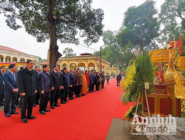 party state officials offer incense at thang long royal citadel