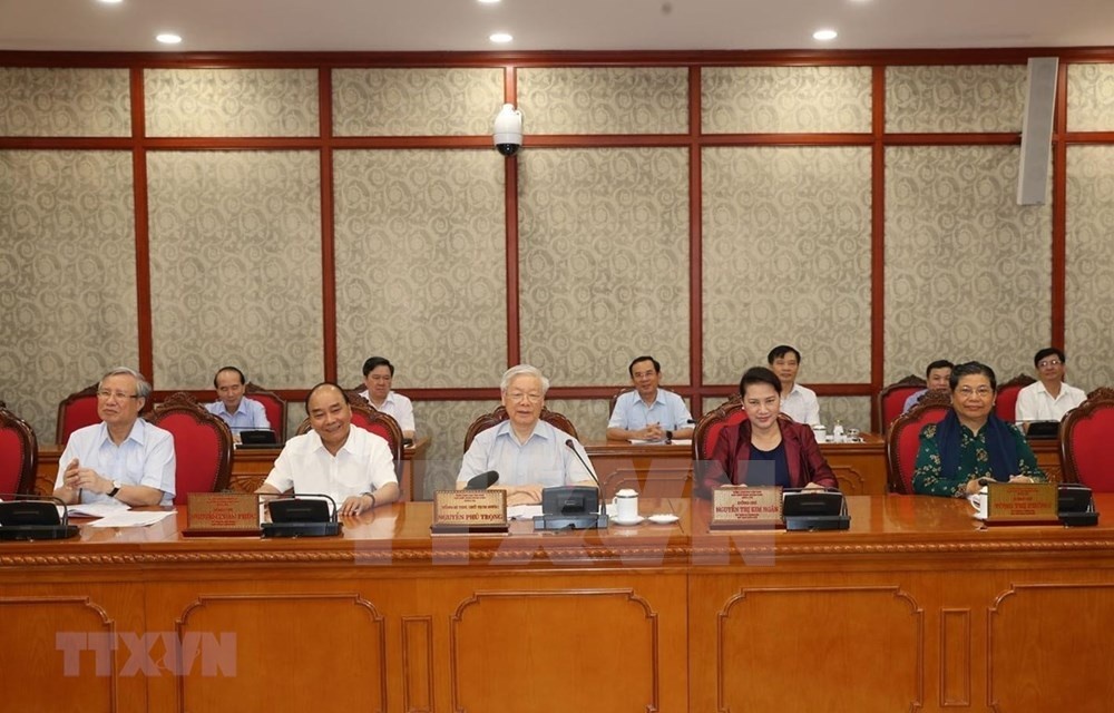 3056 719 party general secretary and state president nguyen phu trong center speaks at the meeting photo vna
