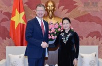 us ambassador his family wear red ao dai to embassy tet event