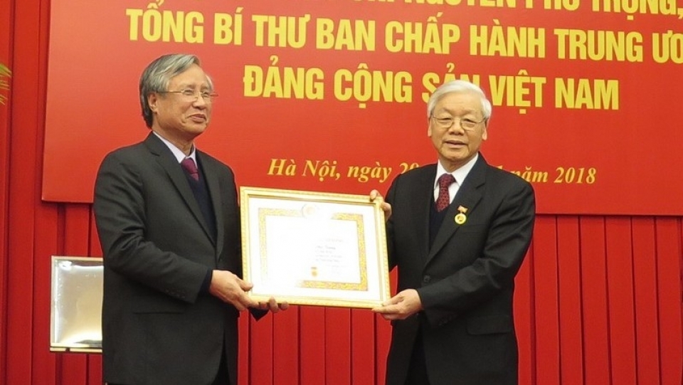 general secretary nguyen phu trong receives 50 year party membership badge