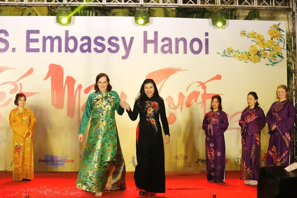 us ambassador his family wear red ao dai to embassy tet event